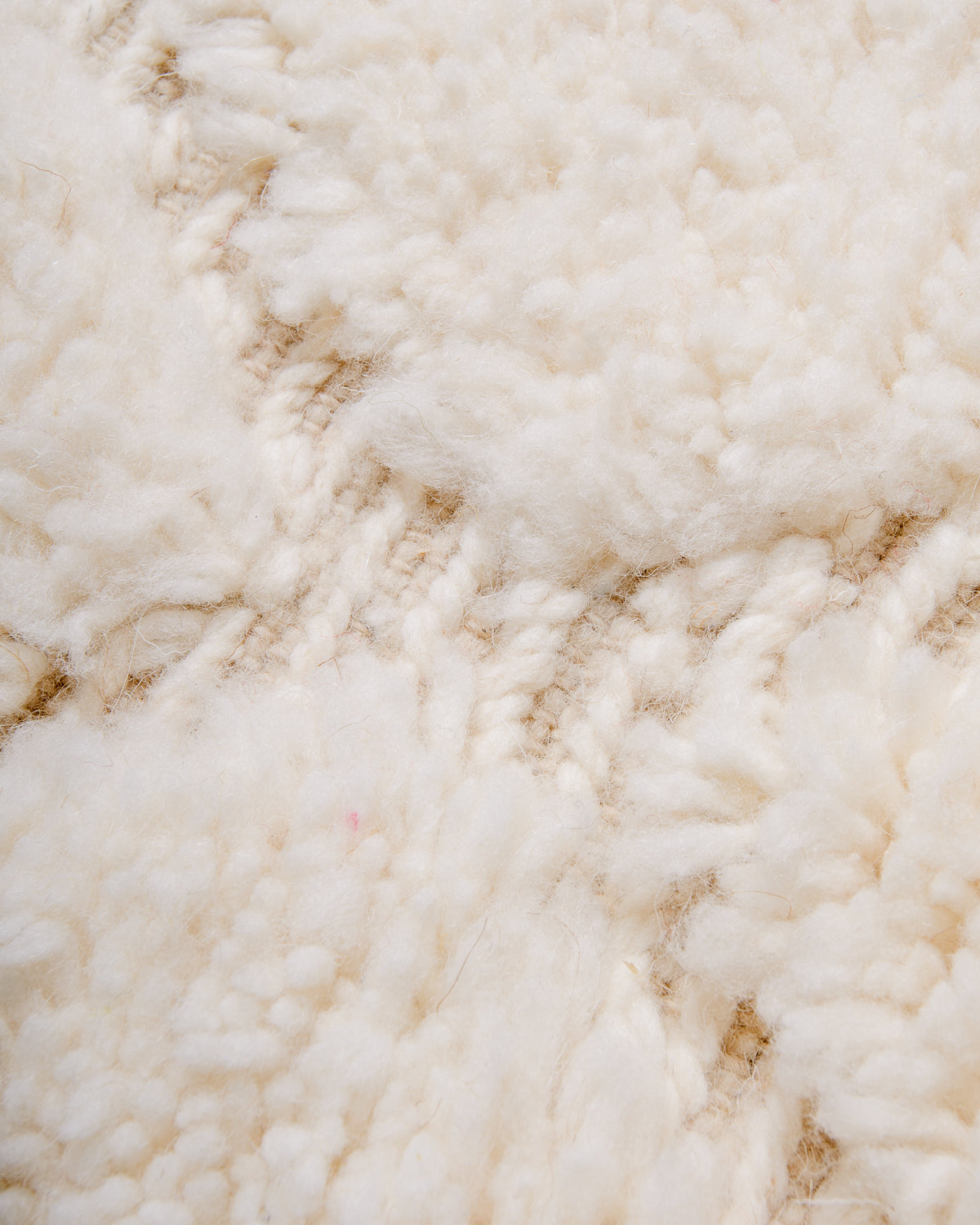 Close up of woven design between plush wool pile.